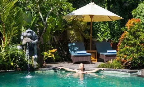 Girl relaxing inside Resort's pool
